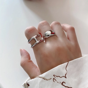 Minimalist 925 sterling silver H-letter and smooth ring set shown on a hand