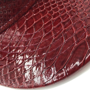 Glossy burgundy crocodile pattern embossed leather baseball cap with a textured flat brim