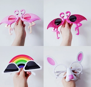 Collage of funny party sunglasses featuring pink flamingo, rainbow cloud and rabbit nose styles