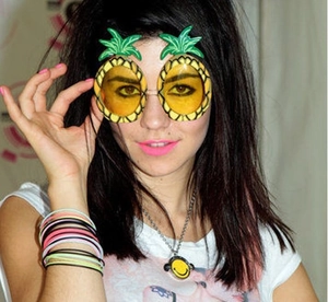 Funny pineapple shaped sunglasses with yellow lenses and green leaves for party fun