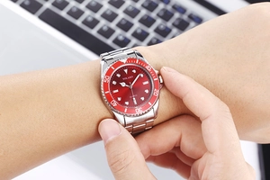 Stylish silver stainless steel men's watch featuring a red dial and bezel by YOLAKO