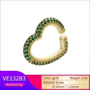Golden heart-shaped brass ear cuff with sparkling dark green pavé-set zircon stones