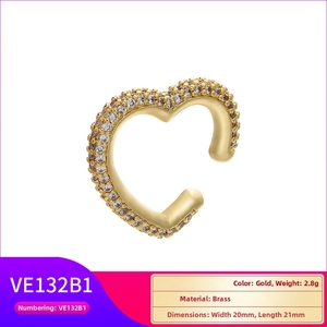 Detailed view of heart-shaped gold ear cuff with white zircon stones and size measurements