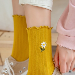 Yellow Japanese style ribbed mid-calf socks with cute daisy embroidery and ruffle trim