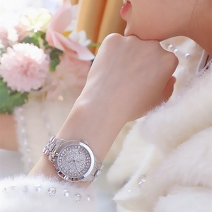 Luxurious silver ladies watch with full rhinestone embellishment and metal strap