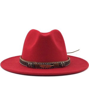 Red wool fedora hat with bohemian braided band and bronze feather pendant detail