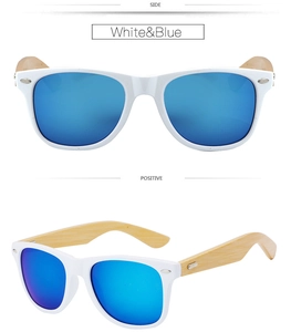 Detail view of white sunglasses with blue coated lenses and natural bamboo temples