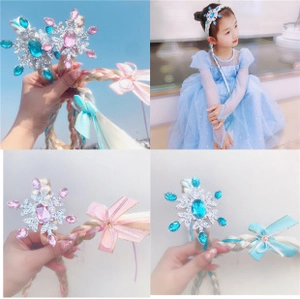 Detail showing snowflake rhinestone hair clip with colorful rainbow hair extensions for girls