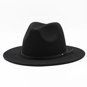 Close-up of black felt fedora hat featuring a slim leather band with a gold rivet detail