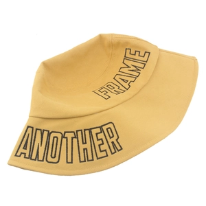 Mustard yellow cotton bucket hat with black embroidered letters and wide brim design