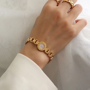 Gold Roman numeral shell bracelet and ring set for women with minimalist shell dial charm