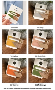 Close-up of matte resin and wood grain hair clips in various candy colors on display cards