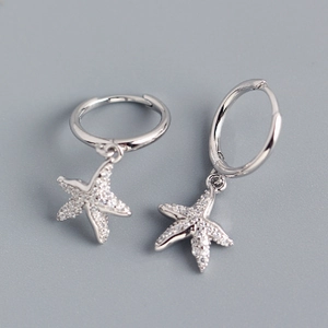 Macro detail of S925 silver starfish earrings with micro-paved cubic zirconia stones