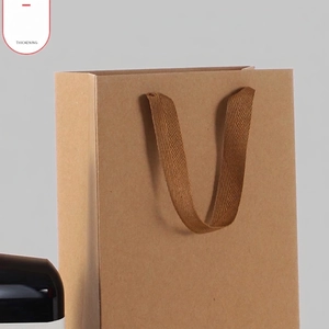 Thickened brown kraft paper wine gift bag with sturdy woven handles and minimalist style