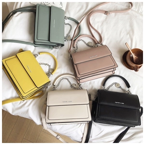Flat lay of Korean style PU leather crossbody bags in five colors with chain detail