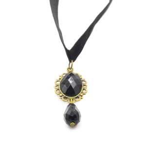 Gothic black ribbon choker featuring a vintage bronze pendant and teardrop crystal