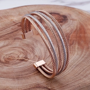 Minimalist multi-strand twisted cable cuff bracelet in rose gold and silver finish