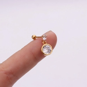 Detailed macro view of golden stainless steel flower zircon helix piercing earring