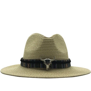 Classic straw sun hat with ethnic band and silver bull head ornament for beach travel