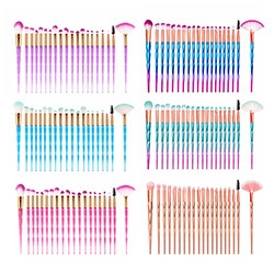 Detail view of 6 sets of unicorn-style makeup brushes with colorful gradient handles