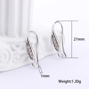 Macro view of silver earring hooks with zircon inlay and detailed size measurements