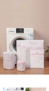 Detailed set of mesh laundry bags in various sizes with pink zippers for washing protection