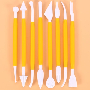 Detailed set of 8 yellow plastic sculpting tools for clay modeling and fondant crafting