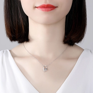 Elegant S925 sterling silver heart necklace with crystal on a woman's neckline