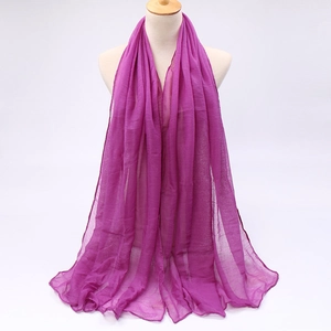 Close-up of lightweight magenta voile scarf showing breathable fabric texture and drape