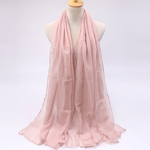 Detail of soft pale pink voile scarf showing lightweight texture and elegant drape