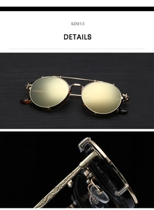 Macro detail of steampunk round flip-up sunglasses with golden engraved metal temples