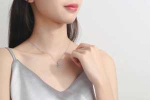 Detail of a S925 sterling silver necklace featuring a 1 carat moissanite solitaire pendant