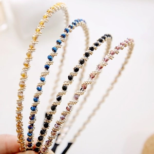 Sparkling crystal headbands set in amber, blue, black and purple with silver wire wrap