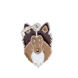 Detailed view of enamel Sheltie dog charm with silver ring on white background