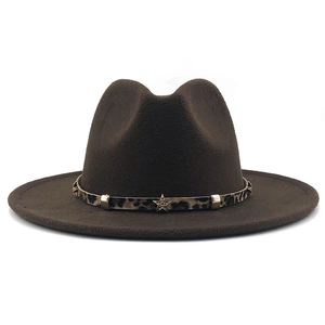 Detail of dark brown fedora hat featuring leopard band with metal buckle and star charm