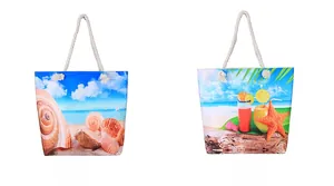 Detail of beach canvas tote bags with thick white rope handles and sea patterns