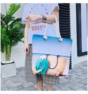 Detail of canvas beach tote featuring summer digital print and thick woven rope handles