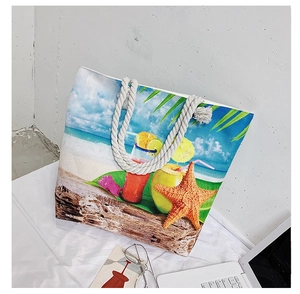 Detail of tropical beach canvas tote with rope handles and vivid cocktail print design