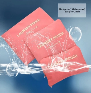 Detail of three pink waterproof laundry pouches with dustproof coating for travel storage