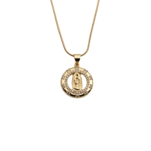 Macro shot of gold religious necklace with virgin mary medallion and cz crystals