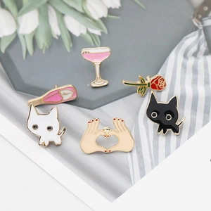 Detail of 6-piece Japanese cartoon enamel pins with cat, wine bottle and rose designs