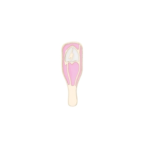 Detailed close-up of a pink enamel pin with a white lightning bolt and golden metal edges