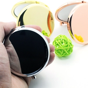 Portable double-sided metal makeup mirrors in black, gold, and rose gold finish
