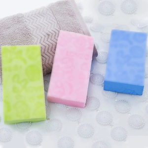 Three-color rectangular exfoliating bath sponges in green, pink, and blue with embossed texture