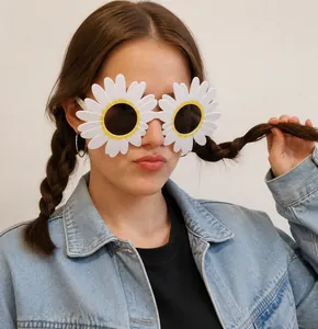 Close-up of white daisy fun glasses for parties and selfies worn by a person