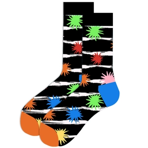 Detail of knit crew socks featuring bold geometric star patterns and colorful contrast toe