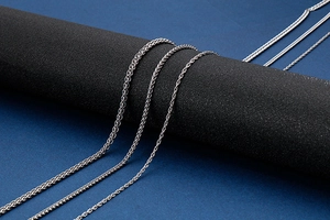 Detailed view of silver stainless steel keel chains with various weave textures