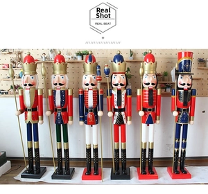 Detailed lineup of six tall wooden Nutcracker soldier statues with festive painted finish