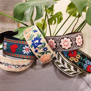 Ethnic style embroidered wide headband collection with floral patterns and fabric texture