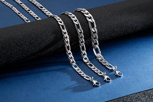 Detailed view of three stainless steel NK chains in various widths with lobster clasps